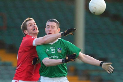 Limerick's Paidi Ahern is tackled by Richard O'Sullivan of Cork during the McGrath Cup Quarter-Final at Newcastlewest