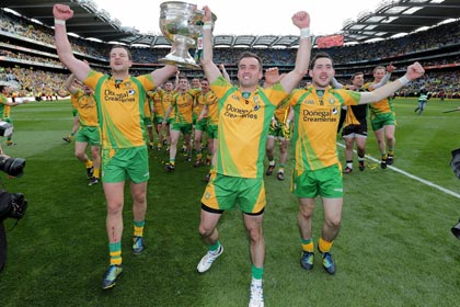 Donegal's Michael Murphy and Karl Lacey and Mark McHugh celebrate with the Sam Maguire INPHO