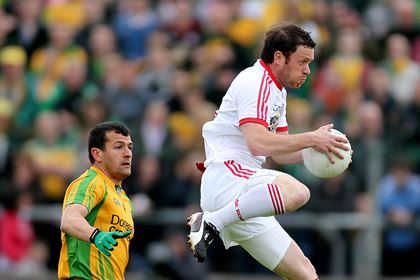 Donegal's Frank McGlynn and Martin Penrose of Tyrone.<br />©INPHO/James Crombie.