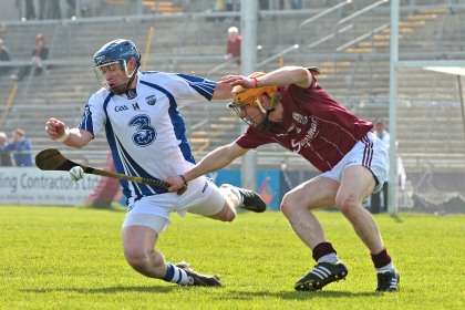 Galway's Ger O'Halloran with Shane Walsh of Waterford ©INPHO/Morgan Treacy